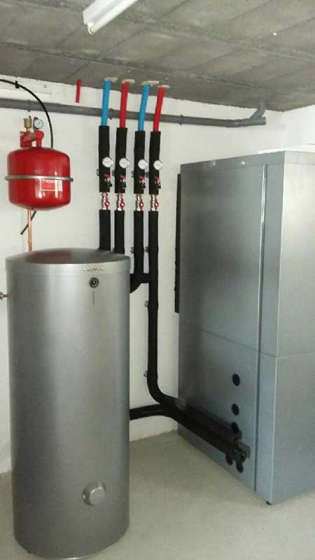 réalisation plombier chauffagiste Val‑d’Oise – Implantation d'une pompe à chaleur air-eau avec un ballon d'eau chaude sanitaire en Île‑de‑France.